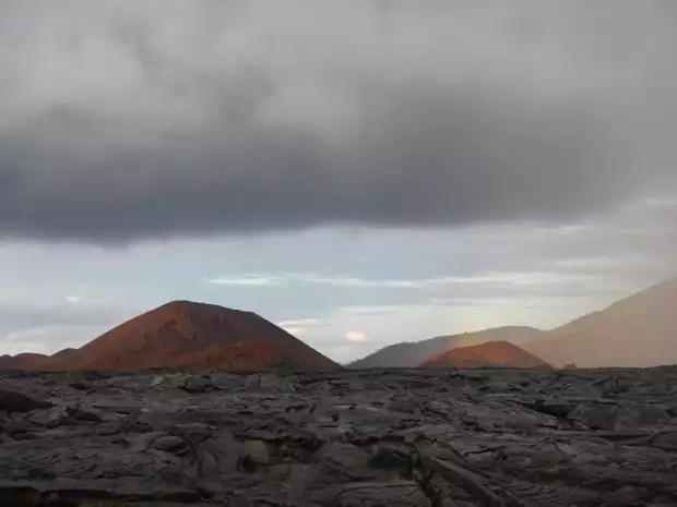 Black volcanic rock and lava flow on a Galapagos island.