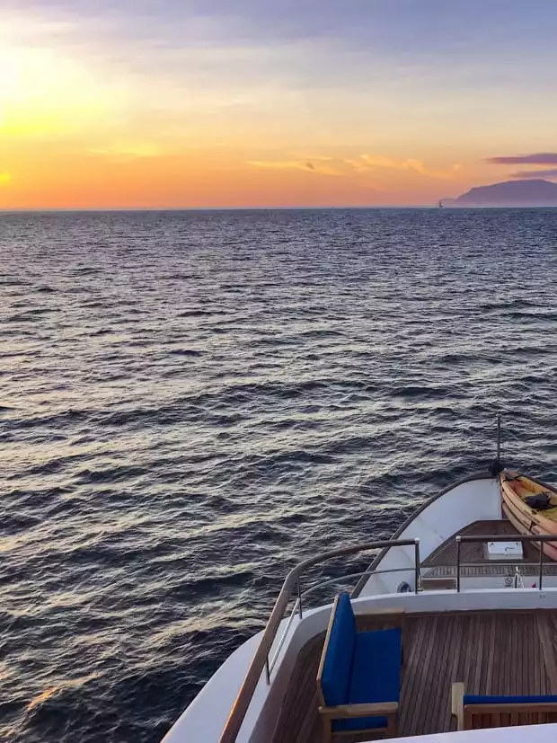 Sunset view from the top of the small ship cruise Passion in the Galapagos.