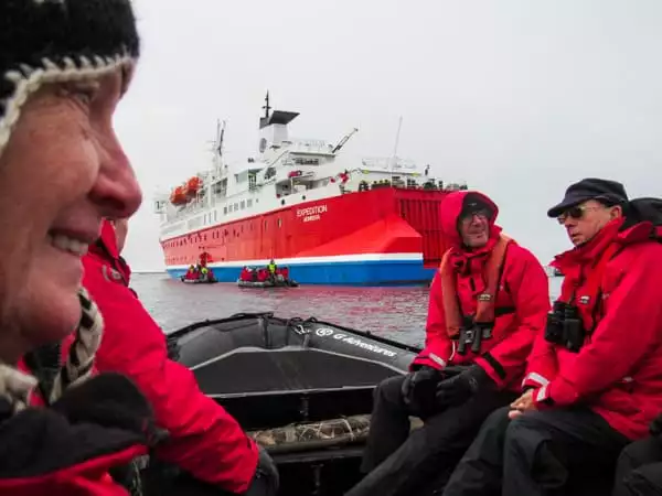 Guests in red jackets on their way back to the ship Expedition