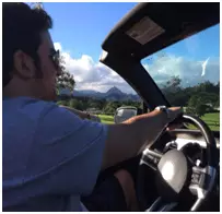 Traveler driving a convertable