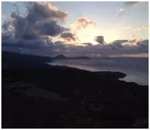 Sunset along the coast with purple and pink colors