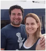 The honeymooning couple smiling