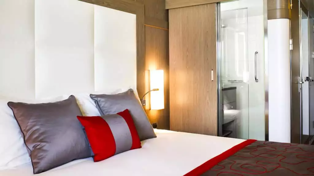Superior Stateroom with king bed aboard Le Boreal. Photo by: Eric Laignel/Ponant