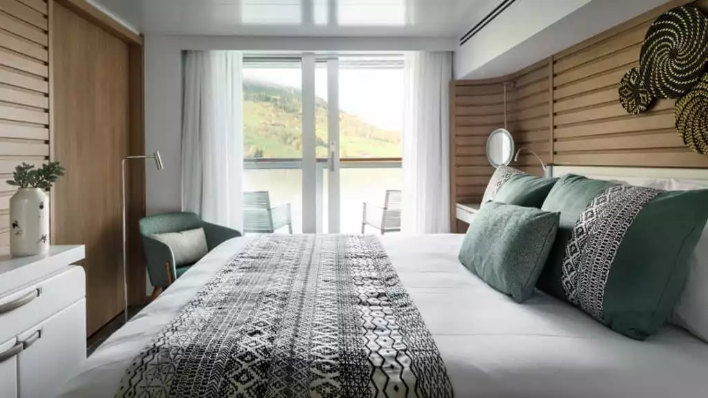 Deluxe Stateroom with king bed aboard Le Champlain. Photo by: Francois Lefebvre/Ponant