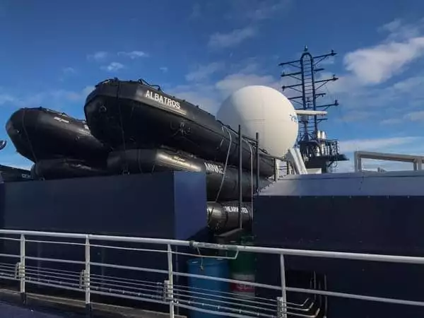 black inflatable zodiacs are shown stored on the upper deck of hebridean sky polar expedition ship  