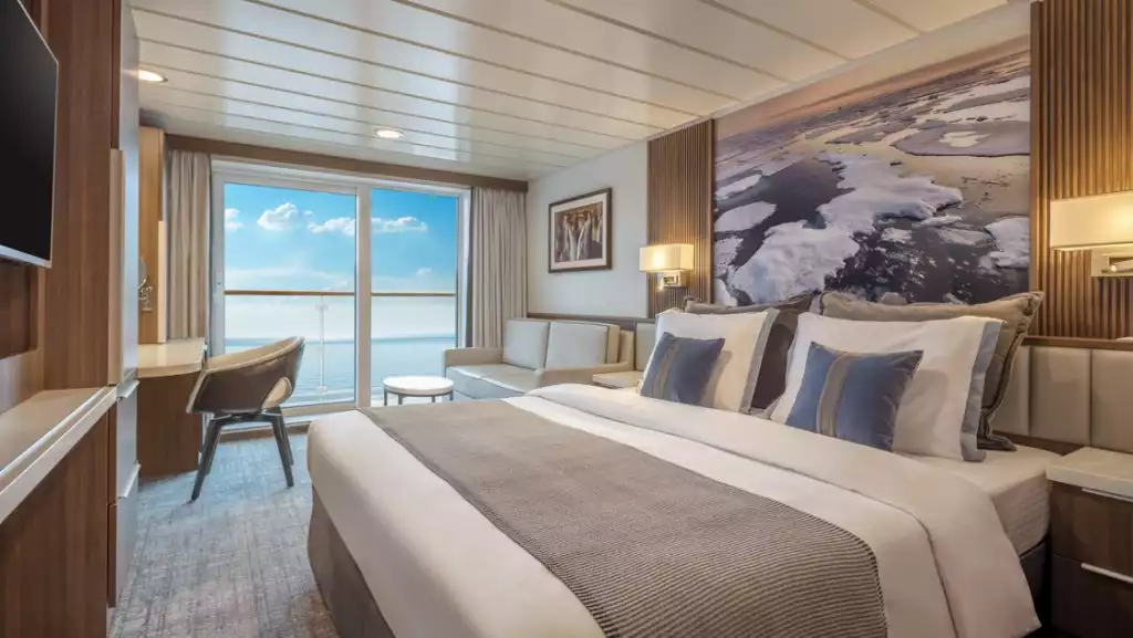 Category B Balcony Stateroom with king bed aboard Sylvia Earle. Photo by: Benjamin Tan & Masano Kawana