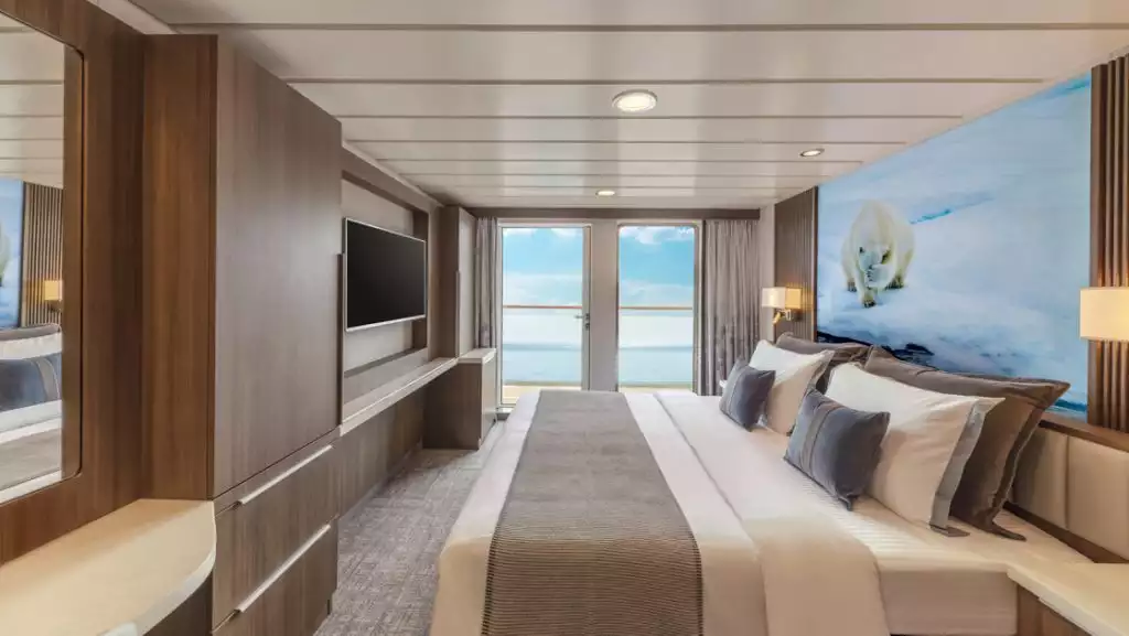 Category C Balcony Stateroom with king bed aboard Sylvia Earle. Photo by: Benjamin Tan & Masano Kawana