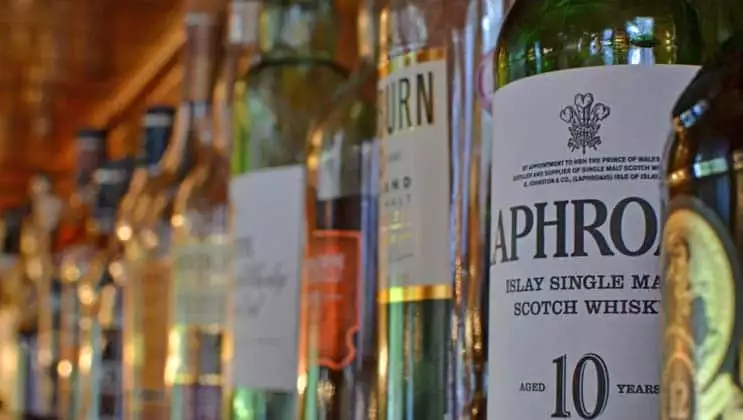 Bottles of Scottish whiskey lined up in a row. seen during the Classic Scotland Barge Cruise.