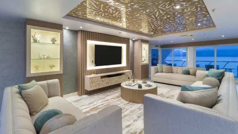 The main lounge features comforts and a stunning view of the beauty of the Galapagos while cruising aboard the Elite