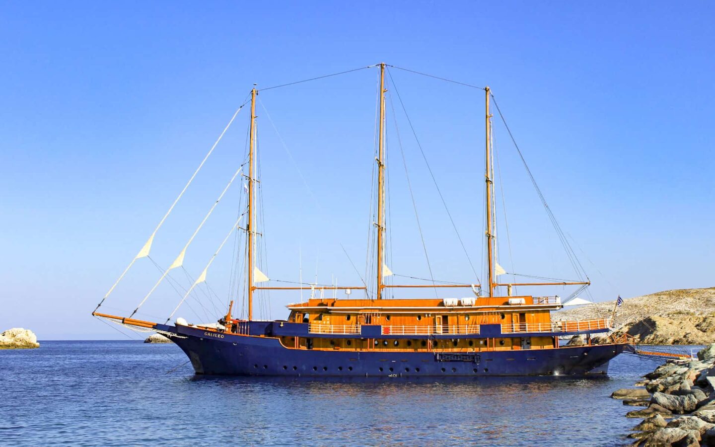 mediterranean small ship cruising in greece on a calm sunny day