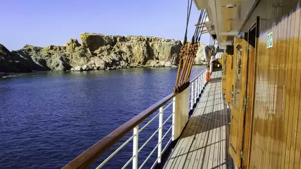 Balcony view of the small ship Galileo in the Mediterranean ocean.