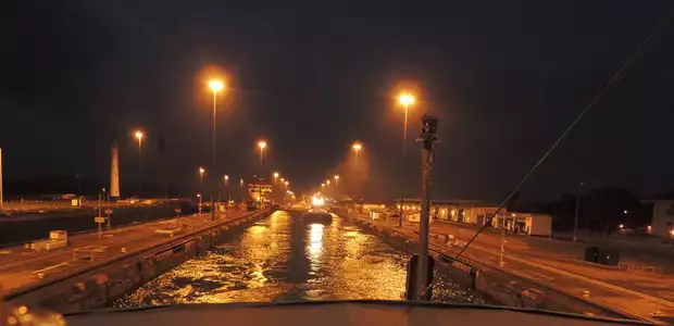 The locks from the bow of the small ship cruise going through the Panama Canal locks.