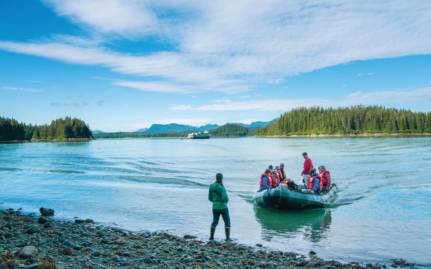 a group of adventure travelers coming ashore during a San Juan Islands small ship cruise in the pacific northwest