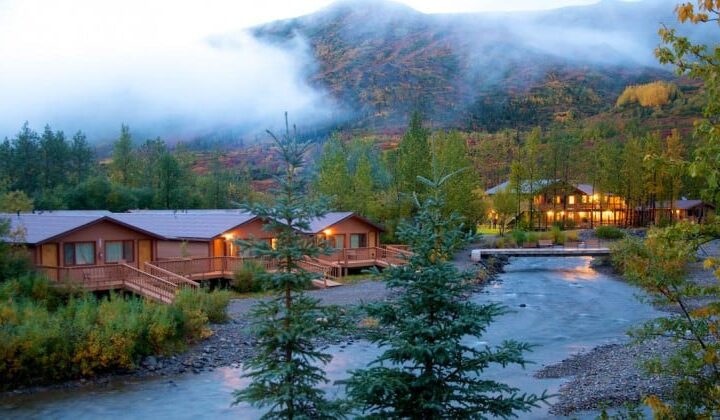 Creekside cabins in the forest at the foot of a mountain in Denali National Park at Denali Backcountry Lodge in Kantishna, Alaska