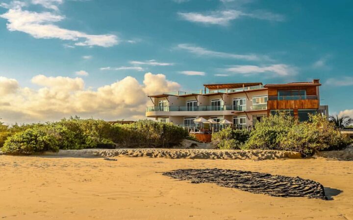 The sustainable resort Iguana Crossing Boutique Hotel sits on the beachfront in Puerto Villamil on Isabela Island in the Galapagos Islands.