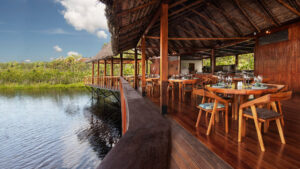 La Balsa Restaurant at the Sacha Lodge in Ecuador with river side seating and views of wildlife and the jungle as you dine