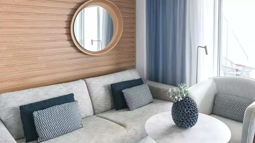 Grand Deluxe Suite second room (lounge) aboard Le Laperouse. Photo by: Ponant