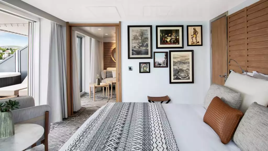 Owner's Suite with king bed aboard Le Laperouse. Photo by: Ponant