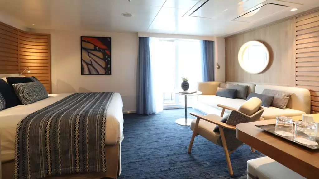 Privilege Suite with king bed aboard Le Laperouse. Photo by: Christophe Dugied/Ponant