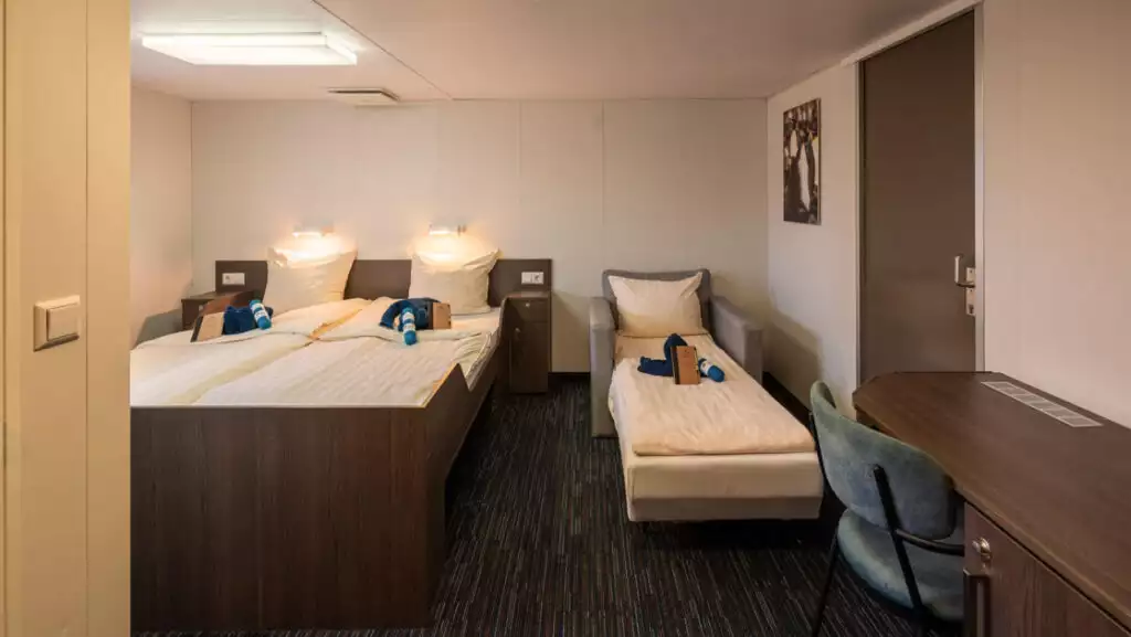 Superior cabin with sofa bed aboard Ortelius. Photo by: Olaf Kramer