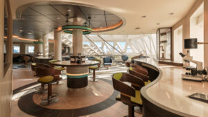 science center of Douglas Mawson ship with marble tables, bar stools, windows & northern lights decorated ceiling.