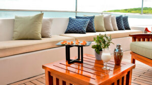 The aft lounge aboard the Seaman Journey with many comfortable cushions and pillows to use while cruising through the Galapagos