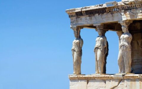 ancient greek architecture with statues of women for columns as seen on a walking tour during the small ship cruise to the greek isles