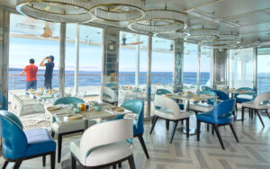 Bright dining room with ocean views aboard a Galapagos luxury expedition ship.