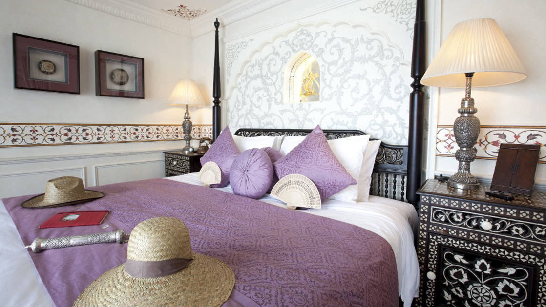 Jahan Suite with queen bed, nightstands and reading lights.