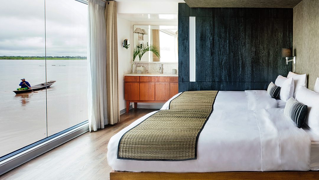 Design Suite with two full Beds and floor to ceiling windows aboard Aria.