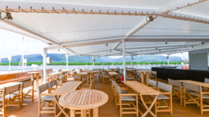 Sit in the shade on the vista deck while you have a beverage watching the beauty aboard the Coral Geographer off the coast of Australia