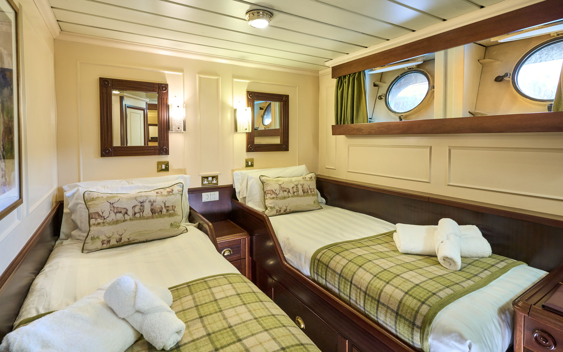 Cabin, Category 1, 111 square feet. Cabin features two portholes and a double bed or two single beds on the Watt deck aboard the ship Lord of the Glens.