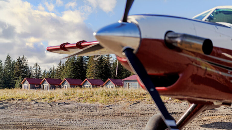 propeller of small aircraft on the shore off of bear camp alaska on a sunny day
