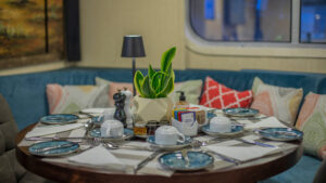 Harmony V yacht round table set up for a meal in the dining room.