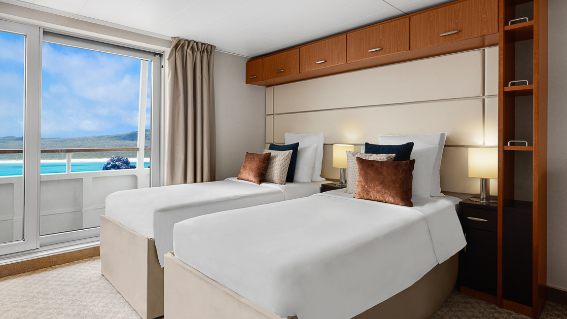 Twin beds on small ship cruse with large slider window with modern design