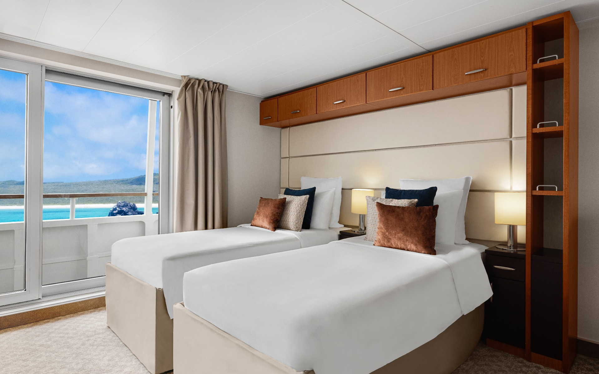 Category 5 cabin with twin beds aboard a Galapagos luxury yacht.
