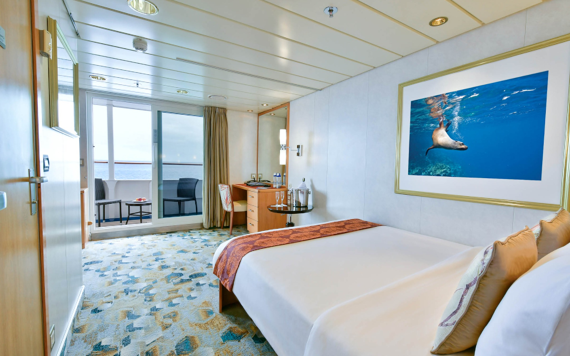 Category 5S cabin with private balcony aboard a Galapagos luxury yacht.