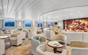 Discovery lounge with panoramic windows aboard a Galapagos luxury yacht.