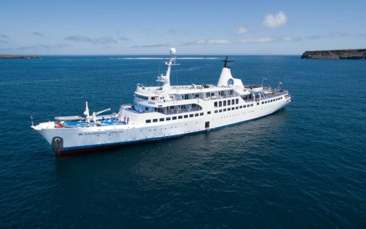 Galapagos Legend ship sailing on blue water photographed from above