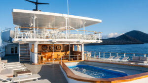 On the upper deck amongst comfortable lounge chairs the Legend maintains a pool for adventurers as they cruise the Galapagos