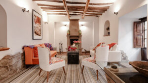 lounge area in Andenes boutique hotel with white walls and wood design,