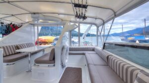 Upper outdoor deck aboard Golden Eagle with covered protection from the wind and rain with wrap around benches for seating.