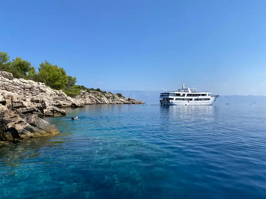 Small cruise ship sailing in the Mediterranean on a bright sunny day off the cost of Croatia