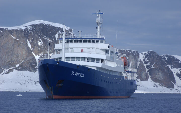 Plancius small ship cruising around Antarctica on a sunny day