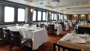 The Stella Australis in Chilean Patagonia features a beautiful dining room with abundant windows to take in Patagonia while you dine