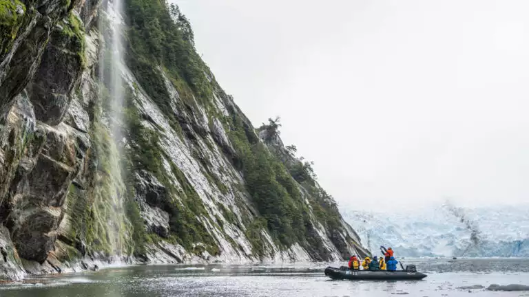 Guests exploring by zodiac enjoying the beauty of the Beagle Channel in Patagonia, Chile.
