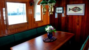 Salon with table aboard Catalyst.