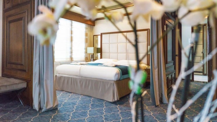 Large bed and large windows in Owner's Suite aboard Sea Spirit expedition ship