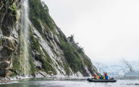 Guests exploring by zodiac enjoying the beauty of the Beagle Channel in Patagonia, Chile.