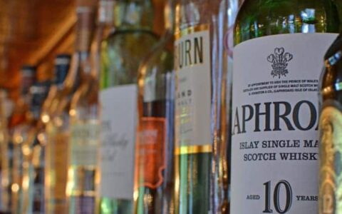 Bottles of Scottish whiskey lined up in a row. seen during the Classic Scotland Barge Cruise.